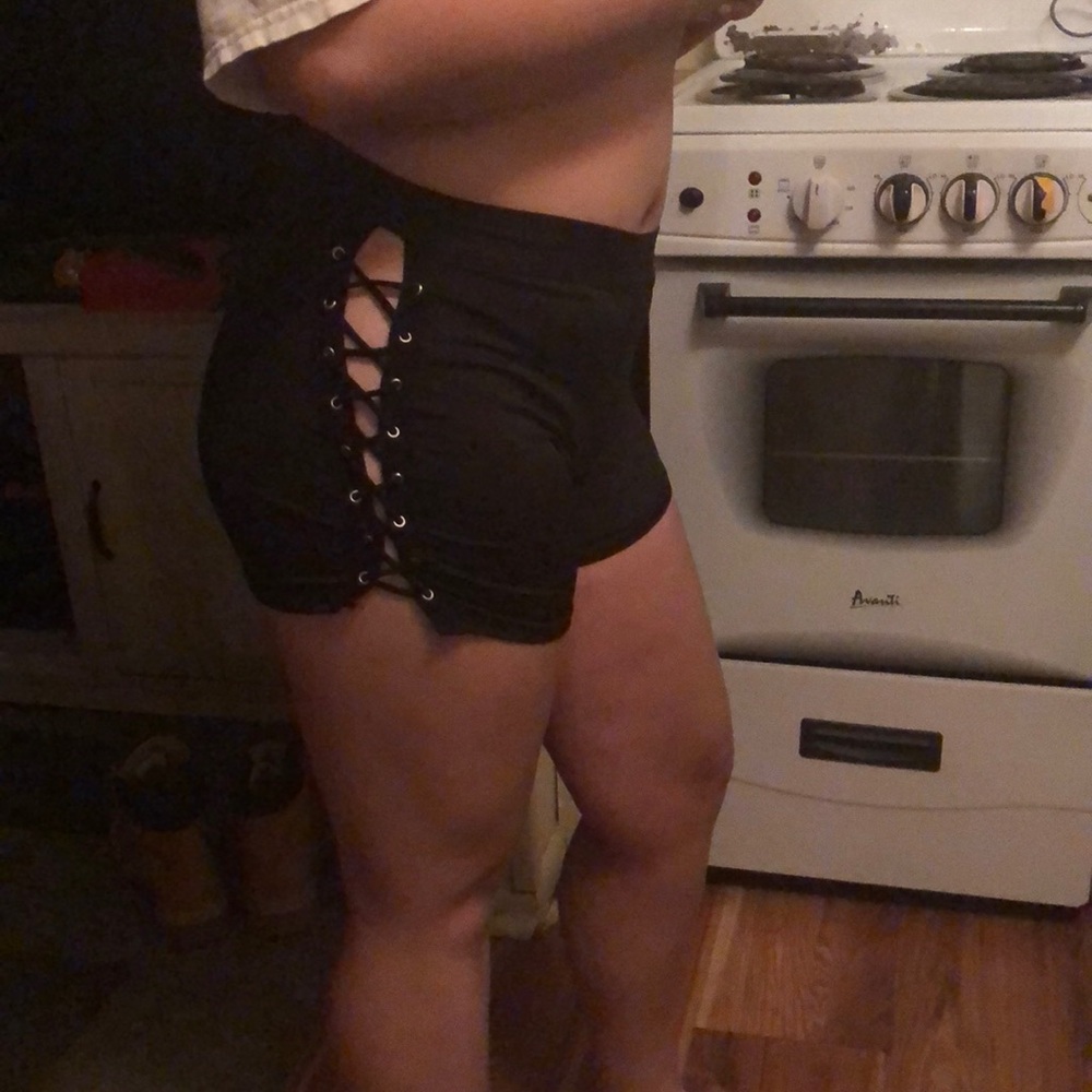 Black shorts laced down leg